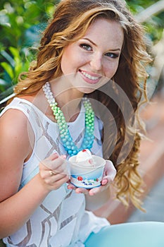 Portrait of a young happy woman in summer