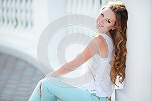 Portrait of a young happy woman in summer