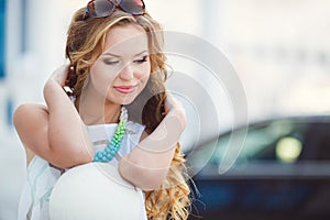 Portrait of a young happy woman in summer