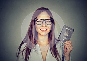 Portrait young happy woman with USA passport