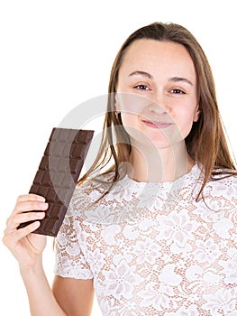 Portrait of young healthy pretty woman holding chocolate bar