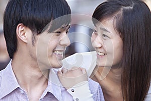 Portrait of Young Heterosexual Couple Smiling in Beijing