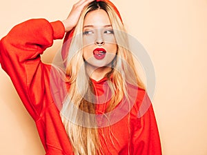 Portrait of young hipster girl posing in studio