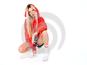 Portrait of young hipster girl posing in studio