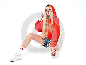 Portrait of young hipster girl posing in studio