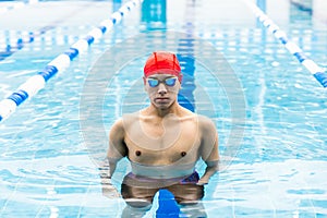 Portrait of young latin man swimmer at the pool in Mexico Latin America