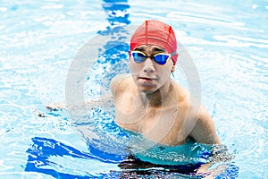 Portrait of young latin man swimmer at the pool in Mexico Latin America