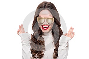 Portrait of young laughing woman with bright makeup wearing gold opaque sunglasses,