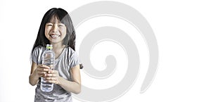 Portrait of young little asian girl hand holding glass drinking water.