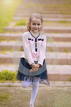 Portrait of young little girl on stairs