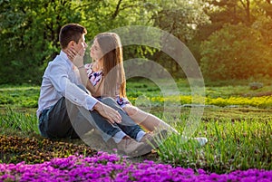Portrait of young love couple in the garden
