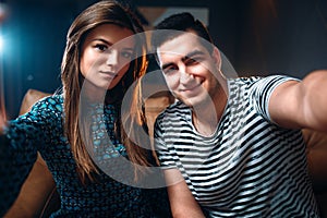 Portrait of young love couple in nightclub