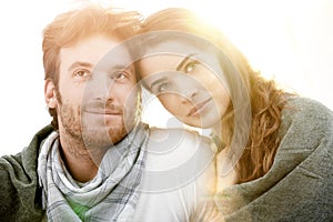 Portrait of young love couple outdoor in sun light in summer