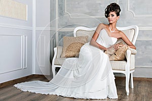 Portrait of young luxurious brunette bride