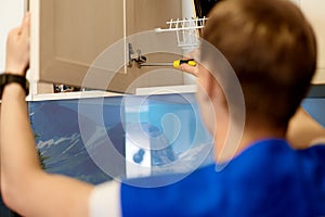 Portrait Young Male Carpenter Repairing furniture door