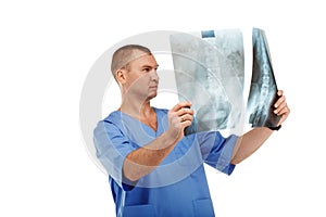 Portrait of a young male doctor in a medical surgical blue uniform