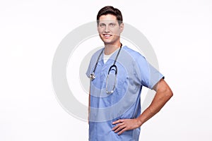 Portrait of a young male nurse posing with hands on hips