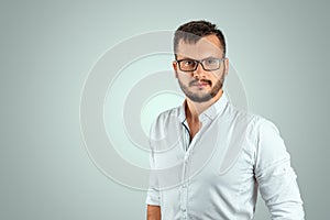 Portrait of a young male teacher on a light background. Teacher`s Day Knowledge Day back to school study online learning