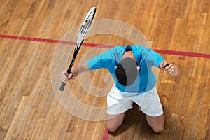 portrait young male tennis player celebrating success