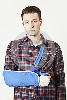 Portrait Of Young Man With Arm In Sling photo