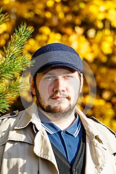 Portrait of young man in autumn forest