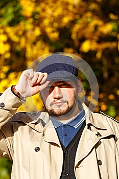 Portrait of young man in autumn forest