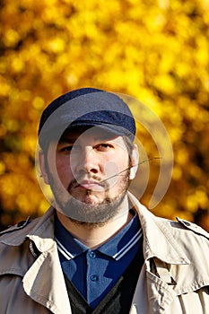 Portrait of young man in autumn forest