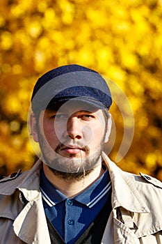 Portrait of young man in autumn forest