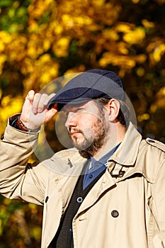 Portrait of young man in autumn forest