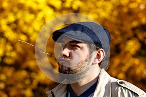 Portrait of young man in autumn forest