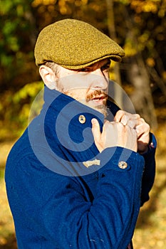 Portrait of young man in autumn forest