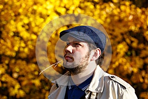 Portrait of young man in autumn forest