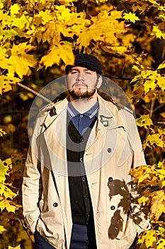 Portrait of young man in autumn forest