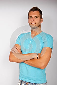 Portrait of young man in azure T-shirt