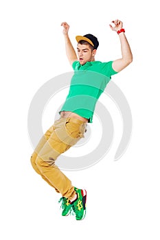 Portrait of young man b-boying in studio isolated on white.