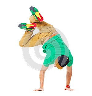 Portrait of young man b-boying in studio isolated on white.