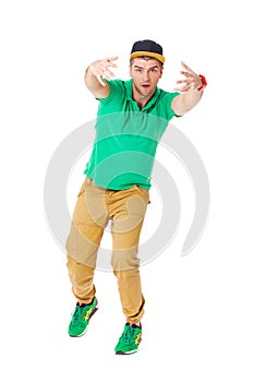 Portrait of young man b-boying in studio isolated on white.