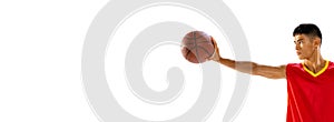 Portrait of young man, basketball player holding ball with one hand isolated over white studio background. Flyer