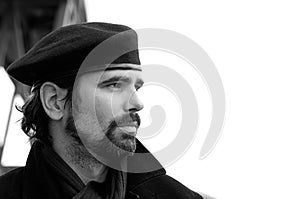 Portrait of young man with beard and beret