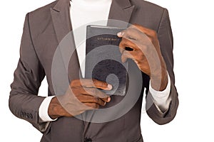 Portrait of young man with a Bible in his hand