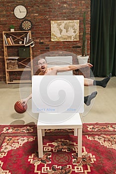 Portrait of young man with blank sign like social media screen sitting at home.