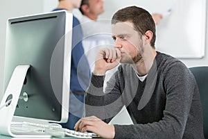 portrait young man and computer class