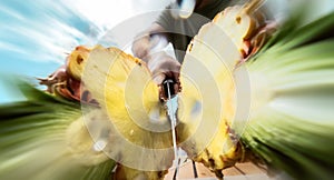 Portrait young man cutting pineapple - Close up male hand holding sharp knife preparing tropical fresh fruits