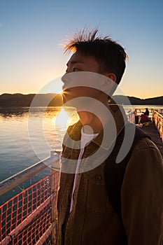 Portrait of young man in deep thoughts and contemplation