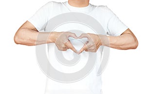 portrait of a young man doing a heart gesture against a white ba