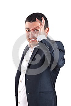 Portrait of young man dressed in a white shirt and black suit an