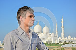 Portrait of a young man in front of mosque