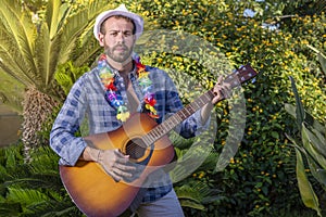 Portrait of young man with guitar in hand