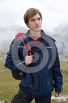Portrait of young man hiking in the mountains