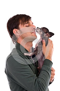 Portrait of a young man holding a cute chihuahua dog